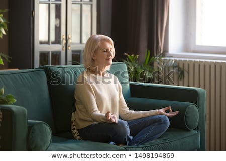 Stok fotoğraf: Elderly Woman Meditating