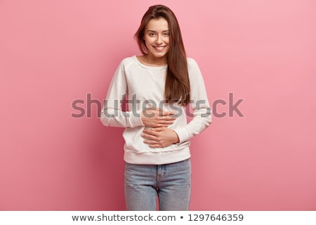 Foto stock: Stomachs Of Women On A Pink