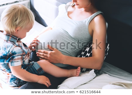 Stok fotoğraf: Pregnant Woman And Her Son