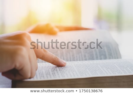 Foto d'archivio: Young Woman Reading An Old Bible