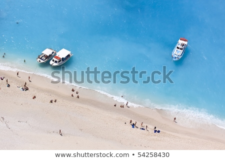 Zdjęcia stock: Motorboat On Anchor At A Sandy Beach