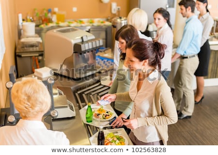 Foto stock: Young Business Colleagues Queue Canteen Lunch