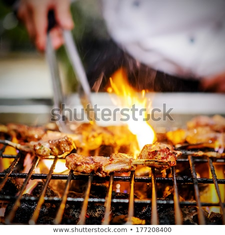 Stock fotó: Chef Bbq Grilled Pork Ribs On Smoke