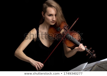 Stock fotó: High Angle View Of Violin With Sheet Music