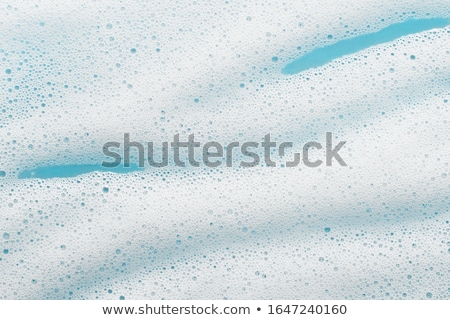 Stock foto: Soap Foam On A Blue Background