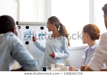 Zdjęcia stock: Business Meeting With Speaker Pointing On Charts