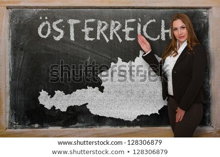 Teacher Showing Map Of Austria On Blackboard [[stock_photo]] © vepar5