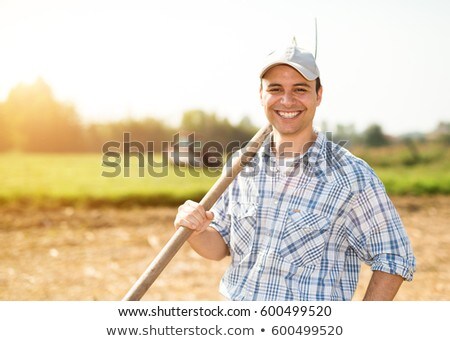 ストックフォト: Farmer With Pitchfork In Wheat Field