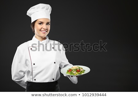 Zdjęcia stock: Portrait Of Chef Holding A Plate Salad In Kitchen