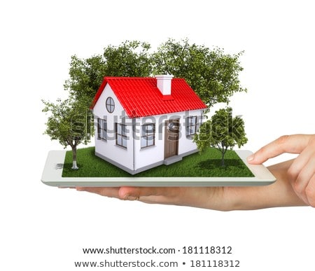 Hands Holding Tablet Pc And Small House With Land [[stock_photo]] © cherezoff