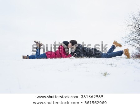 Сток-фото: Two Teenagers Havinf Fun On The Snow Field