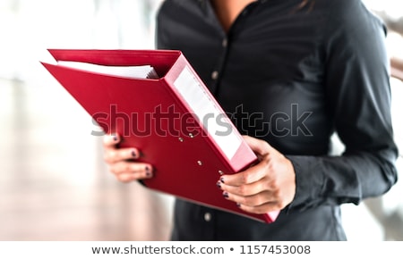 Stok fotoğraf: Businesswoman Or Realtor With Folder At Office