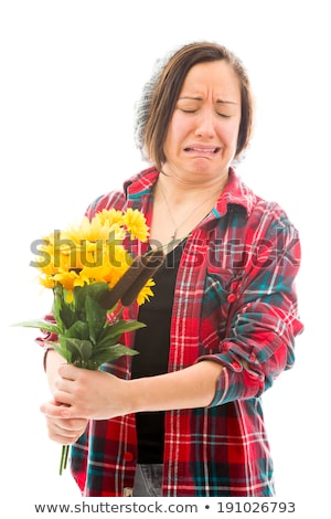 Stock photo: Worried Young Woman Holding Bouquet Of Sunflowers