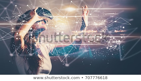 Stok fotoğraf: Woman Using Virtual Reality Headset