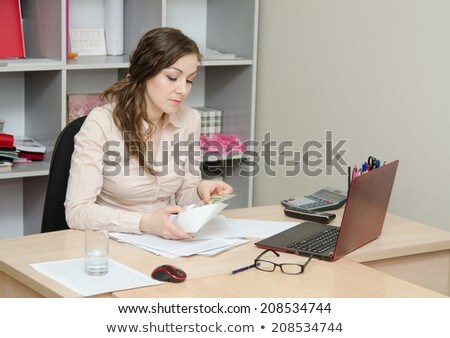 Stock photo: Business Woman Considers Bribe In An Envelope