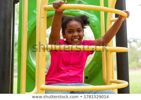 Stock photo: Portrait Of Smiling Girl In Playground