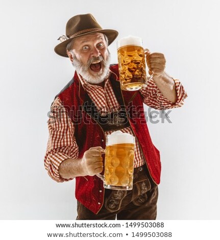 Stok fotoğraf: Man Celebrates The National Holiday In Studio White Background