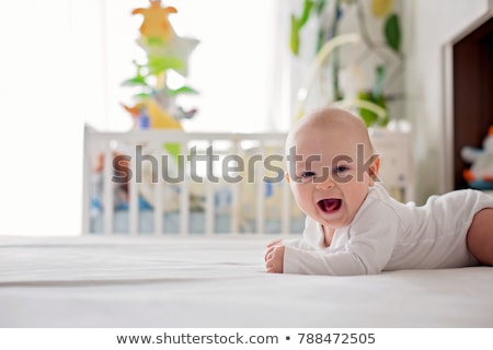 Zdjęcia stock: Cute Four Month Old Baby In Bed At Home