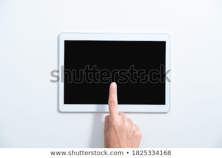 Stockfoto: Finger Touching Tablet With White App Icons Above