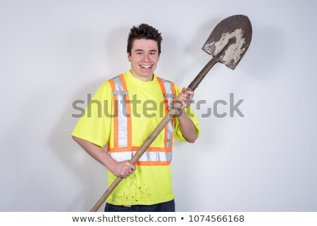 Foto stock: Tradesman Holding A Shovel