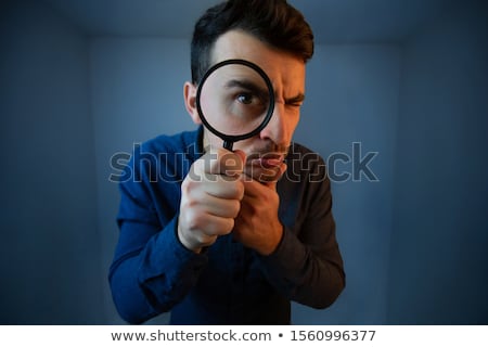 Foto stock: Man With Eye Magnified