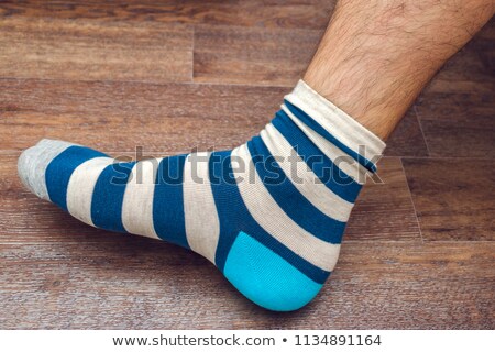 Foto stock: Mens Hairy Legs In Colored Striped Socks Fun
