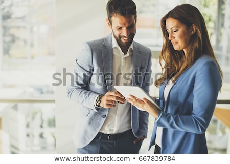 Stockfoto: Business Couple In An Office
