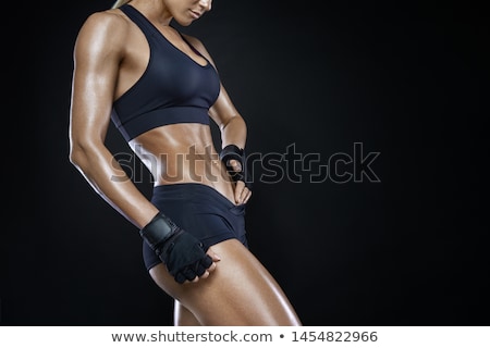 ストックフォト: Fitness Woman With Barbells On Black Background Isolated
