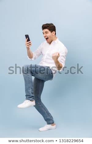 Stock photo: Portrait Of An Attractive Joyful Man Standing