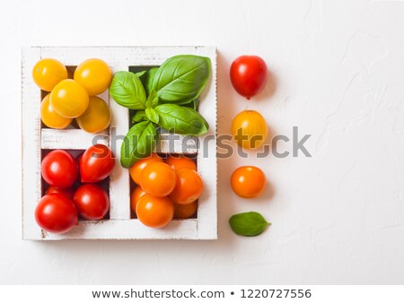 Stock photo: Organic Mini Tomatoes With Basil And Pepper In Wooden Box On Stone Kitchen Background San Marzano