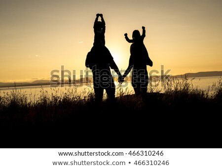 Family Of Four At Sunset Shadow Black Backlit Foto d'archivio © Lopolo