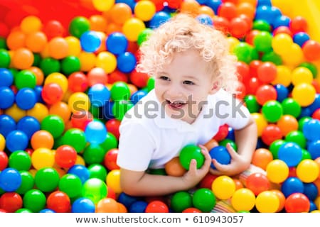 ストックフォト: Happy Little Kid Boy Playing At Colorful Plastic Balls Playground High View Adorable Child Having F