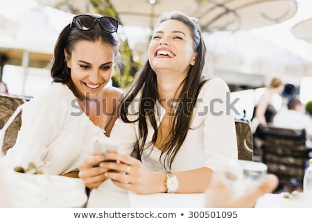 Foto d'archivio: Two Young Girls Talking During Lunch Break