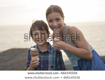 Brother And Sister Eating A Delicious Ice Cream On The Sunset Foto d'archivio © Lopolo