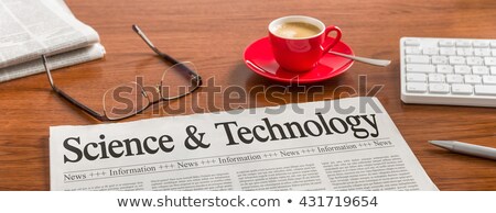 Stock fotó: A Newspaper On A Wooden Desk - Science And Technology