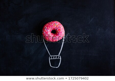 Сток-фото: Black Chalkboard With Pink Glazed Donut