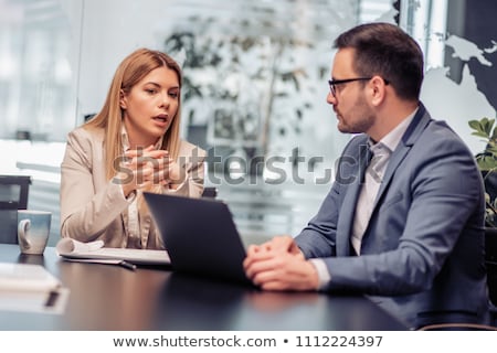 ストックフォト: Two Business People Discussing New Project In Modern Office