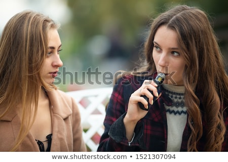 Stock fotó: Woman With Electronic Cigarette