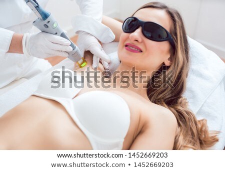 Stockfoto: Woman During Hair Removal Using Modern Laser Technology