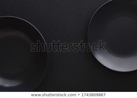 Stok fotoğraf: Empty Plates On Black Background Premium Dishware For Holiday Dinner Minimalistic Design And Diet