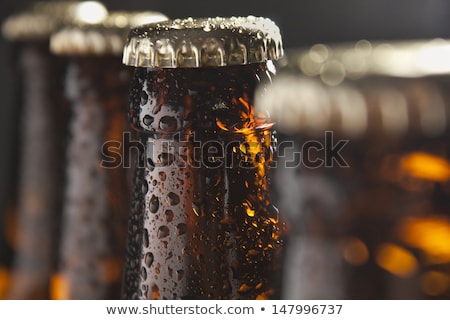 Foto stock: Four Wet Beer Bottles