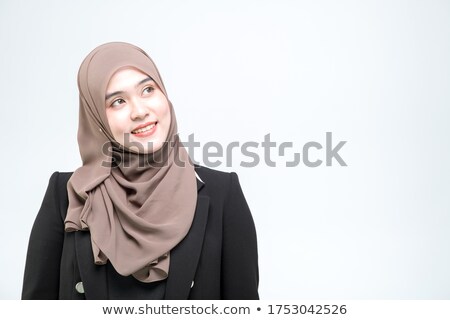 Foto stock: Young Female Looking At Something Above White Background