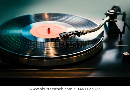 Foto d'archivio: Turntable Playing Vinyl Record With Music