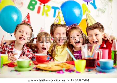 Foto stock: Group Of Adorable Kids Having Fun At Birthday Party