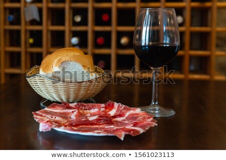 ストックフォト: Serrano Ham With Wine And Bread