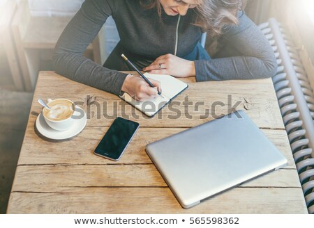 Stock foto: Young Businesswoman With A Closed Laptop