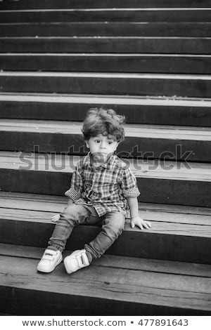 Stok fotoğraf: Funny Girl On The Bench At The Street Photo In Black And White