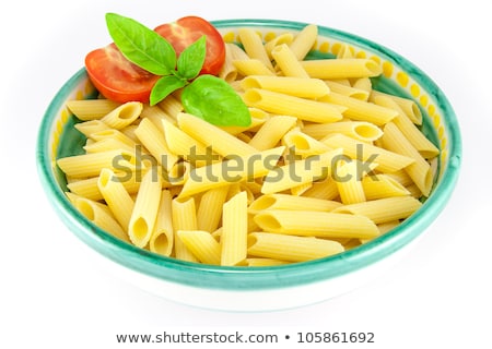 Foto stock: Bowl Full Of Pens Pasta With Tomatoes And Basil