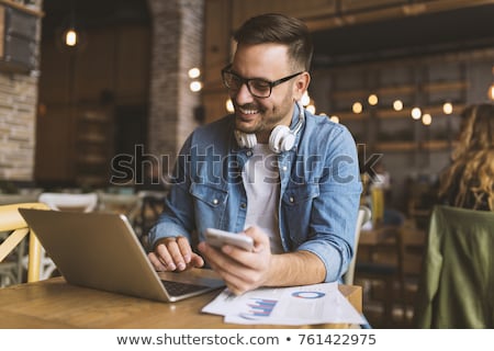 Stok fotoğraf: Man With Laptop Calling By Phone