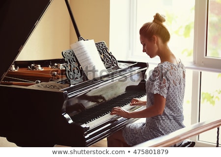 Foto stock: Woman At The Piano